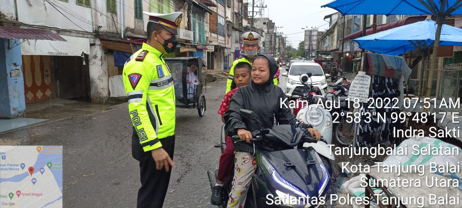 Hujan Deras, Personel Sat Lintas Polres Tanjungbalai Tetap Himbau Warga Tertib Berlalulintas